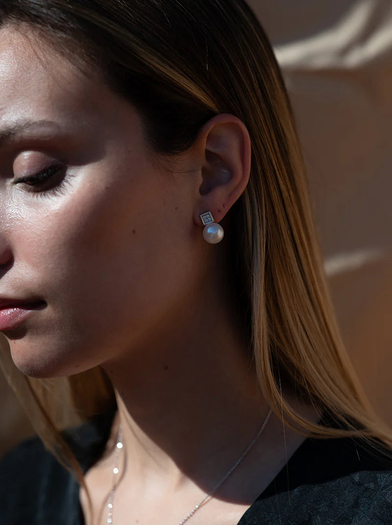 Square design pearl earrings on top