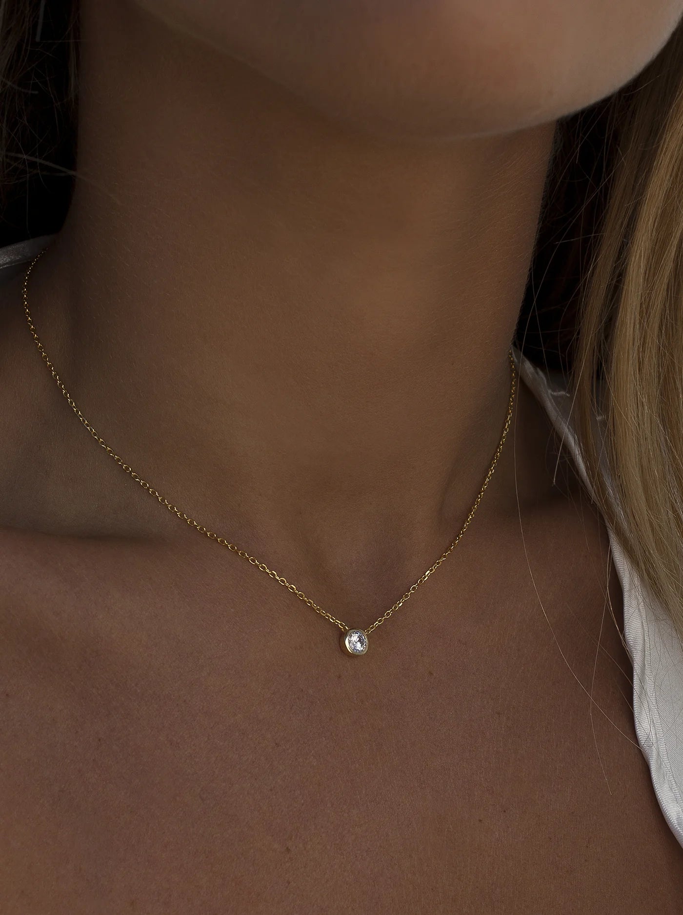 Small pendants with gold central bezel design