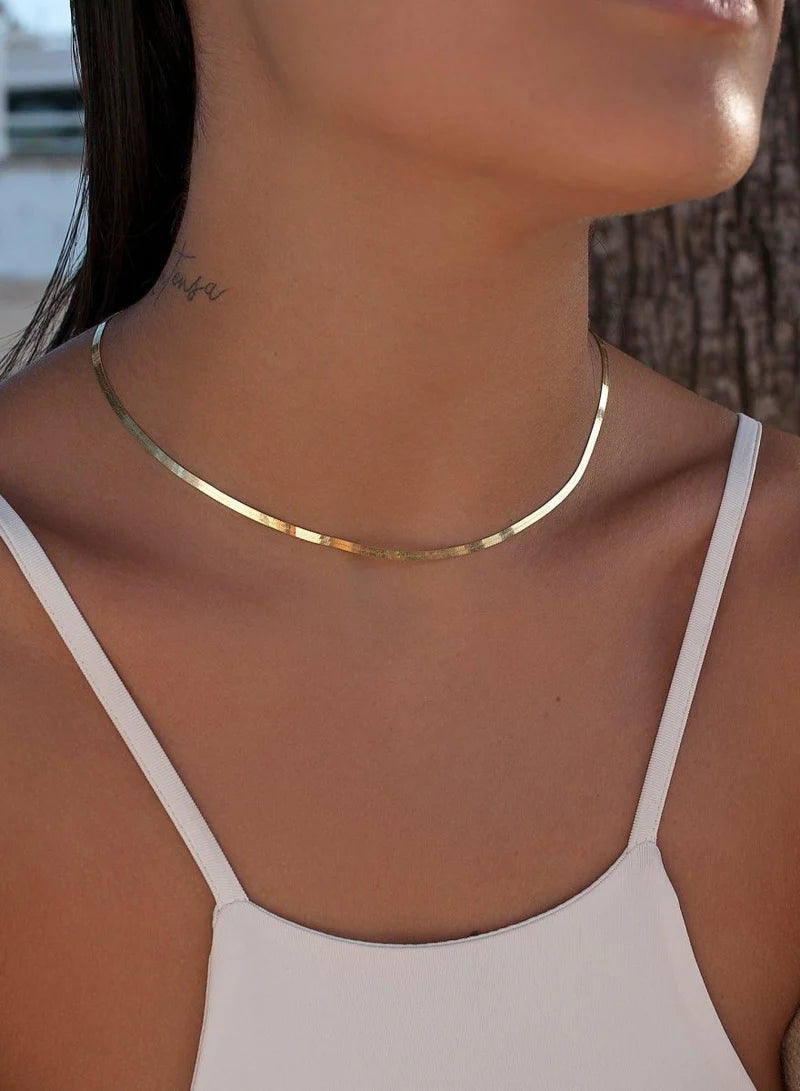 Short necklaces in gold plated silver with snake design